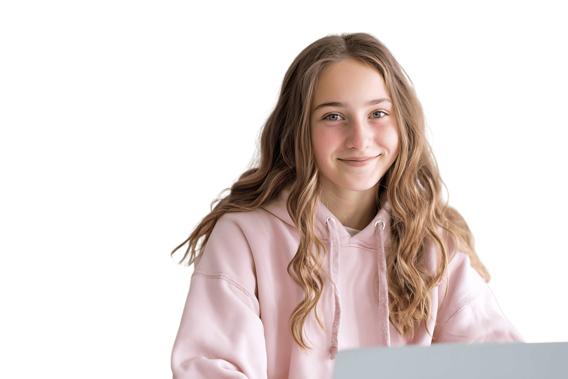 Smiling teenage girl using a laptop.