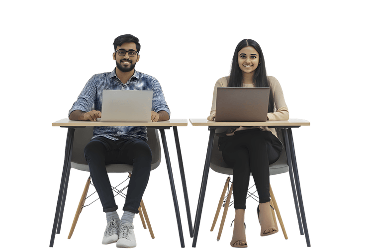 Two smiling students working on laptops in a classroom