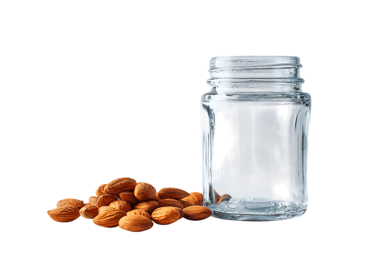 Almonds and an empty jar. Ready to fill.