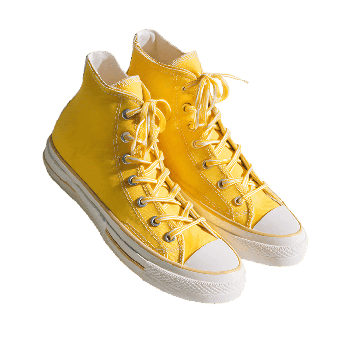 Pair of vibrant yellow high top sneakers isolated on transparent background.