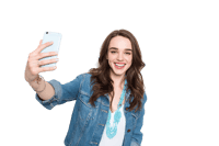 Happy young woman taking a selfie with smartphone