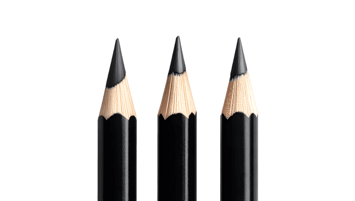 Close up of three sharpened black pencils on black background.