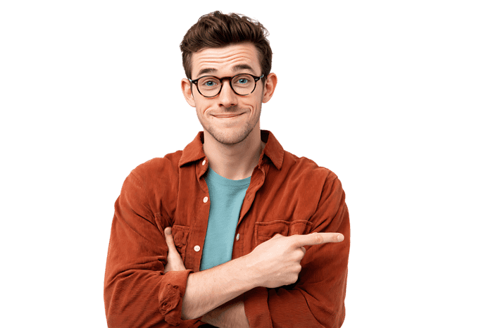 Friendly man in glasses pointing, casual attire, isolated on black background.