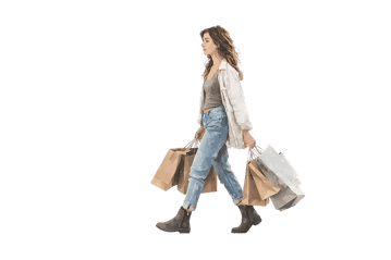 Young woman walking with shopping bags.