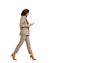 Confident businesswoman walking and using her smartphone.