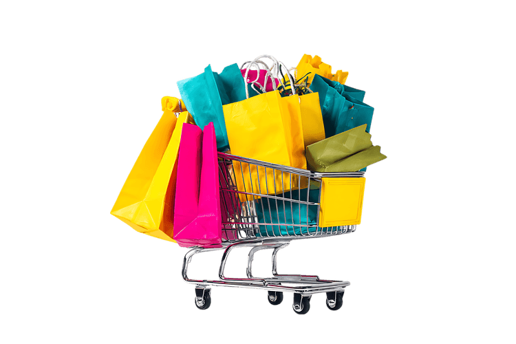 Shopping cart overflowing with colorful shopping bags738.