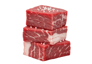 Three raw beef cubes, seasoned with salt.