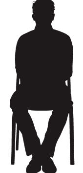 Silhouette of a person sitting in a chair