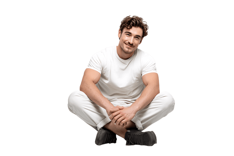 Portrait of a happy man sitting with a smile, isolated on black.