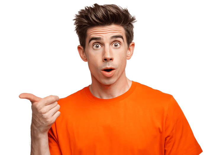 Shocked young man pointing his thumb to copy space. Isolated on black.