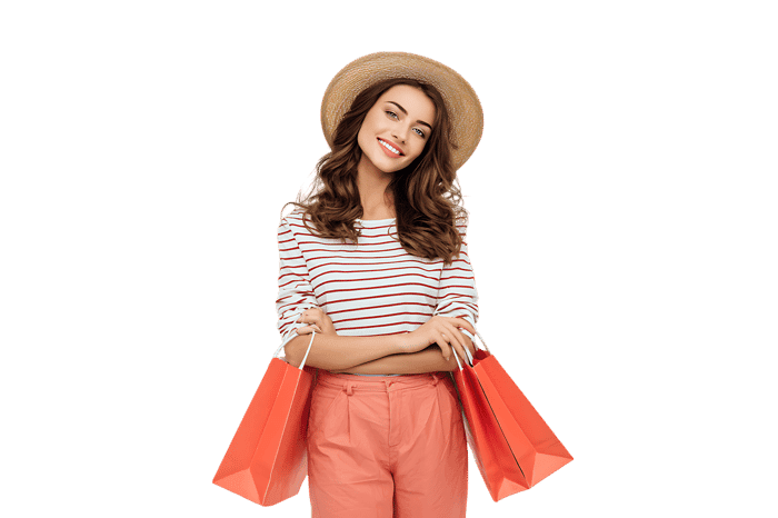 Happy woman with shopping bags after a successful shopping spree.