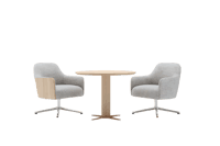 Two modern armchairs and a small round table.