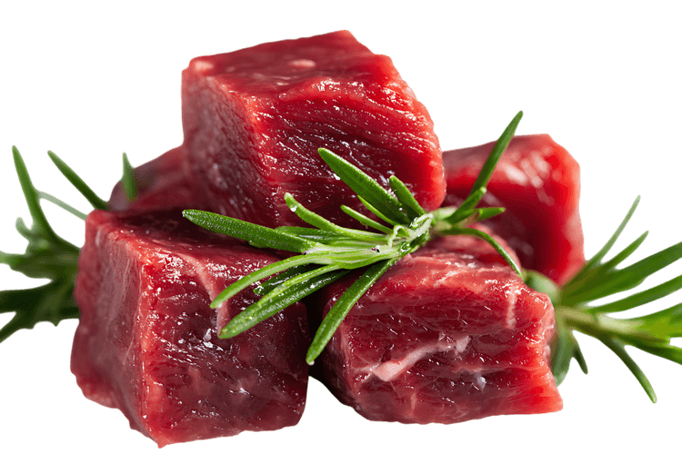 Close up of raw beef cubes with rosemary.
