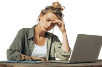 Young woman feeling stressed while working on her laptop outdoors.